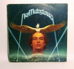 Disco de Vinil - LP Original - NEY MATOGROSSO - Ano: 1982 - Possui encarte com letra das músicas - Medida: 31 x 31 cm. - obs: Disco apresenta arranhões superficiais.
