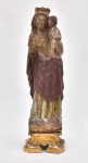 ARTE SACRA, uma (1) antiga imaginária de Nossa Senhora da Fartura ou Consolação (possivelmente), apresenta-se de pé, segurando na mão direita um coração (poderia ser uma romã no caso N. S. Fartura) e no outro braço carregando o Menino Jesus que carrega uma pomba branca (espírito Santo no caso N. S. Consolação), confeccionada em madeira com rica resquícios de douração. Policromada. SÉCULO XVIII/XIX. Medida:  44 cm de altura x 14 cm de largura x 10 cm de profundida de sem a peanha. Peanha em madeira nobre entalhada decorada ao centro com flor de lis folheada à ouro. Bordas esculpidas com folhas de acanto. Medida: 8 cm de altura x 15 cm de comprimento x 13 cm de largura