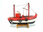 Antiga miniatura artesanal de Barco Pesqueiro em madeira policromada em branco, vermelho e azul, muito bem detalhada. Inscrição Paraty-RJ, Brasil.  17 cm.
