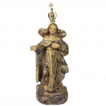 Escultura em madeira policromada representando Santa Rita de Cássia. Acompanha coroa em metal. Brasil, Séc. XIX. 31 cm de altura com a coroa e 26 
cm de altura sem.
