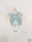 Enfeite Bibelo  em porcelana  Rebis Representando Dama Antiga  com vestido rendado tonalidade azul  algumas perdas no vestido. Medida: 12 cm altura