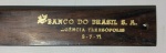 Antiga e rara régua em jacarandá do Banco do Brasil,possui escrições em dourado  pertenceu a agência de Petrópolis ,item no estado mede 3 cm alt. x 0,5 mm larg. x 28,8 cm comp.