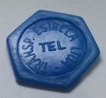 ANTIGA FICHA DE ÔNIBUS - Transportes Estrela LTDA - centro contém inscrição "TEL" - no estado - formato hexagonal, na cor azul. Mede 2,6cm espessura x 3cm diâmetro.