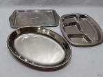 Lote composto de travessa oval, petisqueira com 4 divisões e bandeja retangular, peças em aço inox. Medindo a travessa oval 35cm x 23,5cm x 4,5cm de altura.