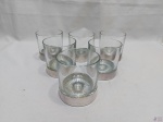 Jogo de 6 copos de whisky em cristal com base em prata 90. Medindo 8cm de diâmetro x 8,5cm de altura.