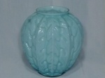 Antigo vaso em vidro opalinado na cor azul claro, estilo Art Déco, bojo decorado com folhagens em alto relevo. Borda com pequenos bicados. Med. 20 x 19cm.