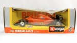 Ferrari F1 641/2 , marca Burago na caixa original, em perfeito estado de conservação - Escala 1/24. A caixa apresenta detalhes.
