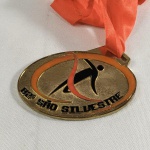 ESPORTE - CORRIDA DE SÃO SILVESTRE. Medalha com fita da 82ª corrida de São Silvestre ocorrida em 2006.