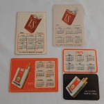 Lote com 4 calendários de bolso com tema de cigarros / indústria fumagueira. Cigarros Hawai e LS. Anos de 1969 - 1970 - 1973 - 1975. Estão emplástificados e medem aprox. 9,5cm de altura