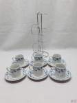Jogo de 6 xícaras de café em porcelana com estampa floral. Acompanha suporte em aço inox.