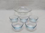 Lote de travessa redonda bowl e 5 cumbucas bowl em vidro incolor. Medindo a travessa 27,5cm de diâmetro x 9,5cm de altura.