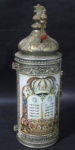 DIVERSOS -Uma (1)  Tifara Judaica contendo um atorá que moisés nomeou os filhos de Israel ,como souvenir de jerusalém, confeccionado em metal prateado decorado com escritas religiosas. Medidas: altura 26 cm.