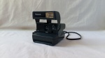 Antiga camera fotografica, Polaroid, no estado.