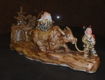 Grupo escultorio em porcelana representando homem sentado em bufalo guiado por menina - China Sec XX
