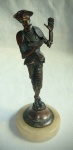 Antiga Escultura Diferenciado em bronze (Década 60/70)representando Dom Quixote leitor, sobre base esférica em granito. Alt 19 cm