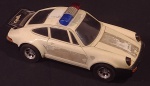 Porsche da Polícia; Marca: Estrela; Material: Polímero; Com luzes: Sim; Com som: Sim; Funcionando; Ausência dos adesivos policiais; Antigo Conservado; Comprimento x Largura x Altura: 30 cm x 13 cm x 11 cm; Olhem as Fotos!