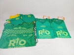 2 Camisas sendo 1 Masculina P e 1 feminina GG Olympikus Rio, 2 viseiras o e 2 bolsas. sem uso