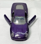 Colecionismo -Miniatura ,reprodução perfeita do Aston Martin DB7 na cor roxa, em metal com detalhes em plástico, portas abrem,  pneus emborrachados, medindo 11cm de comprimento.