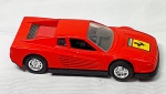 Colecionismo- Miniatura de carro FERRARI vermelha toda em metal com pneus emborrachados, portas não abrem, medindo 11,5cm.