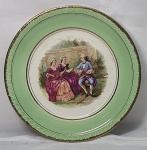 Antiguidade - Prato de parede em porcelana Nadir Figueiredo com famosa imagem do pintor Fragonard, filetes dourado, medindo 20,5cm de diâmetro.