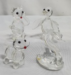 Cristal- Quatro miniaturas de bibelôs em cristal sendo um urso, um pinguim, um gato e um cisne, medindo de 3,5cm a 5cm.