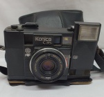 Antiguidade  -  Máquina fotográfica  Konica C35 EF compacta câmera de filme 35mm com ESTOJO Cinta Japão, não testada, vendida no estado.