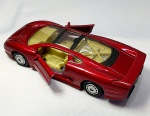 MINIATURA- Miniatura  do Jaguar XJ220. Um magnífico carrinho ricamente detalhado, em metal e plástico, suas rodinhas são emborrachadas,cor vinho, funciona a fricção, medindo 12cm.