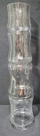 Grandiosa freurs solitaire em vidro translúcido no formato de gomos de cana, medindo 40cm de altura por 7cm de diâmetro.