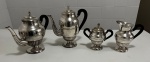 Conjunto de metal espessurada a prata, contendo dois bules, um açucareiro e uma leiteira. Altura do maior 24 cm.