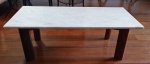 Mesa de centro da década de 1960 em madeira nobre com amarração em X, selo de época. Acompanha tampo em mármore carrara. Medida: 120 cm x 55 cm x 43 cm. Observação: Retirada em Ipanema com hora marcada.