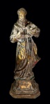 SÃO FRANCISCO DE ASSIS. Antiga imagem sacra confeccionada em estuque. Vestígios de douração a ouro brunido e pátina. Altura = 52 cm. Peso = 4 kg.
