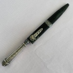 Antiga Faca Gaúcha, lâmina em inox e cabo em metal espessurado à prata, corneta em plástico com aplicação em metal, (faltando ponteira) med. 28cm 