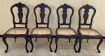 Conjunto de 4 cadeiras executadas em  jacarandá, ricamente entalhada e assentos em palhinha. Estilo D. José. Brasil, séc. XIX. 44 x 51 x 103 cm de altura