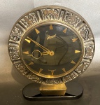Junvel - Relógio de mesa Alemão, maquinário a corda, base em acrílico. 7,5 x 19 x 26 cm de altura total. (Obs. Não foram realizados testes de funcionamento)