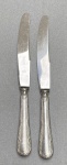 HERCULES. 12 facas de servir de metal prateado. 25 cm de comprimento