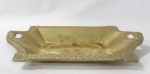 BRONZE - Belíssima fruteira em bronze dourado, cinzelado com riqueza de detalhes, ornamentada com guirlandas de folhas, cruzetas e perolados, pegas vazadas finalizando em volutas. Med. comp 36,5 cm x larg 21 cm.