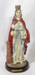 ARTE SACRA - Imaginária em resina, ricamente detalhada e policromada, representando Santa Bárbara. Medidas alt 30 cm x comp da base 12,5 cm x larg da base 11,5 cm.