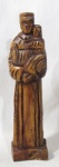 ARTE SACRA - Imaginária em madeira, ricamente entalhada, representando Santo Antônio. Medidas alt 34,5 cm x comp da base 9 cm x larg da base 5,5 cm.