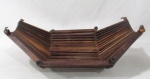 DESIGN JOAQUIM TENREIRO, uma (1) fruteira ou centro de mesa, articulada, confeccionada em jacarandá, medindo aberta 33 x 26,5 x 11 cm, (Joaquim Albuquerque Tenreiro, 1906, Melo Guarda, Portugal; 1992, Itapira, SP; em 1928 transfere-se definitivamente para o Rio de Janeiro; cursou desenho no Liceu Literário Português e fez cursos no Liceu de Artes e Ofícios; em 1931 integrou o Grupo Bernardelli; entre 1933 e 1943 trabalhou como design de móveis para Laubissh & Hirth; Leandro Martins e francisco Gomes; em 1943 monta sua primeira oficina Langerbach & Tenreiro; na década de 60 passou a dedicar-se quase que .exclusivamente as Artes Plásticas, principalmente escultura).