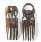 ARTE AFRICANA - Dois pentes garfos em madeira entalhada, sendo um encimado com figura africana tribal e um com elefante, medindo: maior: 19 cm de altura/ menor: 17,5 cm de altura.