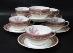PORCELANA SCHMIDT - Seis xícaras para chá com seus respectivos pires, em porcelana vitrificada branca, decoradas com motivos florais em rica policromia em reserva no interior das xícaras e ao centro dos pires, seguido de bordas adornadas com guirlandas de folhas e arabescos, generosos filetes e gregas em pintura à ouro, sobre faixa esmaltada na tonalidade rosa, alças vazadas arrematadas com vasta douração, marcados no fundo. Med. xícaras: alt 5 cm x diam 9,3 cm/ pires: 14,2 cm. Em ótimo estado!