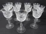 CRISTAL - Onze taças para vinho em cristal europeu translucido ricamente lapidado à mão, com caneluras e sulcos , haste longa e serrilhadas apoiada sobre base circular estrelada. Seis taças com ínfimos bicados na borda. Medida 15 cm X 7,5 cm.