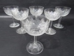Seis taças em fino cristal europeu para champanhe/sobremesa decorada com palmas e pingos de diamante, haste facetada e base circular estrelada. Medida 13 cm X 8,5 cm.