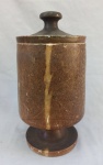 DIVERSOS, um (1) vaso com tampa de pé alto, confeccionado em soapstone (pedra sabão), torneado e polido, possui pequenos defeitos do uso, medindo 29 cm altura.