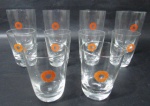 CRISTAL -Dez copos em cristal sendo 4 para água e 6 para shot decorado com símbolo na cor laranja marcados na base. Medida Maior 12 cm X 7,5 cm e menor 8 cm X 6 cm.