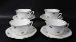 PORCELANA - MAUÁ - Quatro xícaras para chá com seus respectivos pires, em porcelana nacional vitrificada branca, delicadamente decorados com motivos florais em policromia, alças vazadas, bordas filetadas à ouro, marcados no fundo. Med. xícaras: alt 5,3 cm x diam 9,3 cm/ pires: diam 14 cm.