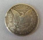 NUMISMÁTICA, USA, uma (1) moeda, 1 dólar, prata (900 milésimos), 1891 O (cunhada em New Orleans), 26,5gr, 38,1mm diâmetro, bom estado de conservação, popularmente conhecida como MORGAN, designer George T. Morgan.