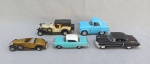 BRINQUEDO, cinco (5) carrinhos miniatura: 1 Cadillac Eldorado 1953, marca WELLY; 1 Ford Thunderbird 1955, marca KINSFUN; 3 outros sem marca, usados.