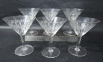 Seis taças para champanhe/sobremesa em cristal europeu translucido ricamente lapidado à mão, com caneluras, ranhuras e losangos , haste lisa apoiada sobre pé circular. Duas taças com ínfimos bicados. Medida 13 cm X 10 cm.