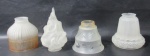 Lote contendo 4 cúpulas em vidro com modelos , tamanhos  e decorações distintas. Medida maior 17 cm X 5,5 cm e menor 11 cm X 5 cm.